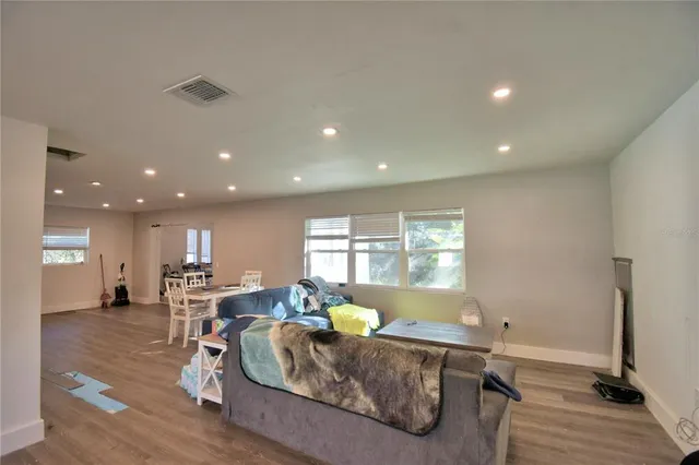 a living room with furniture and a table