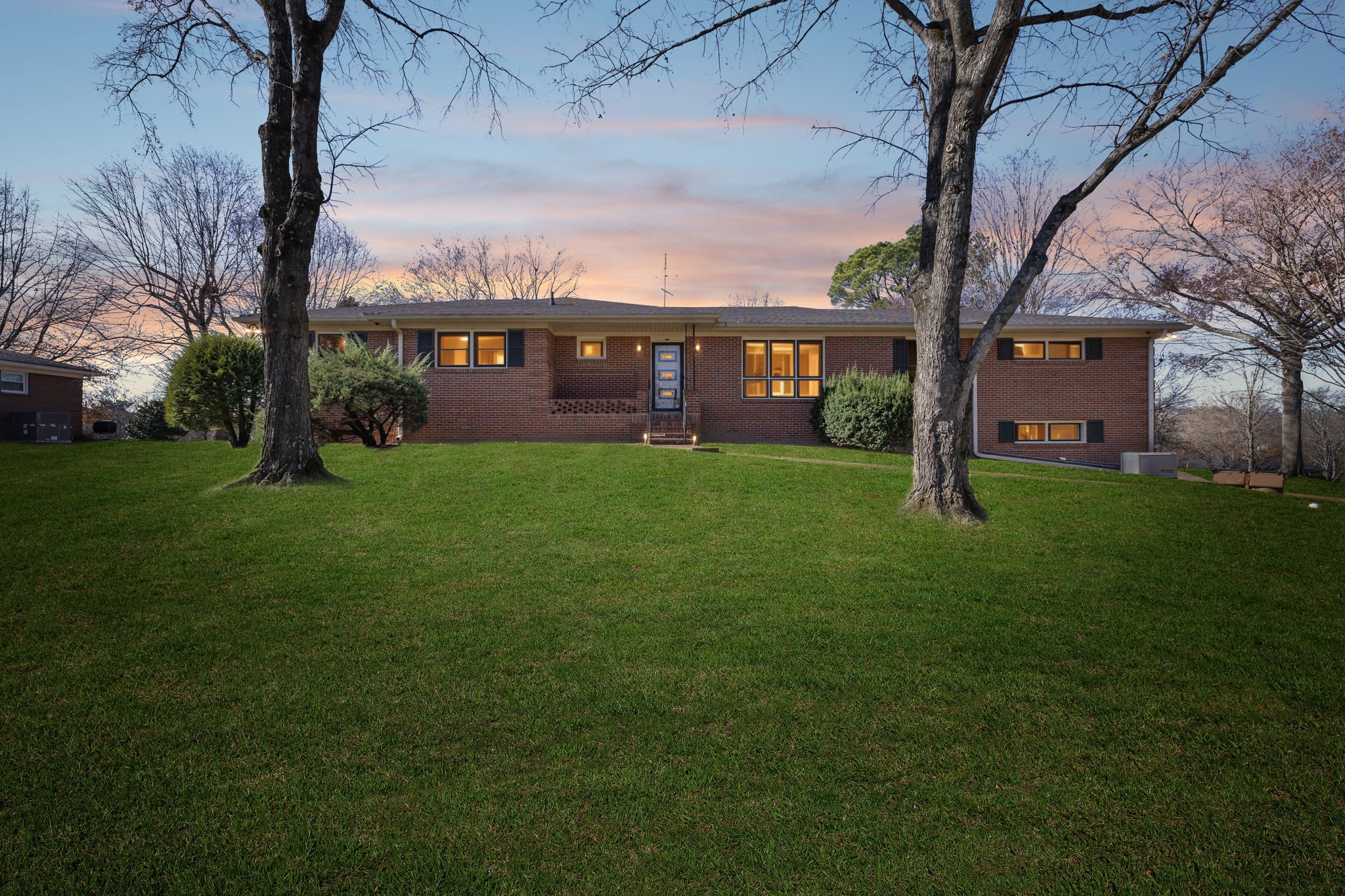 5414 Hill Rd Circle Nashville, TN 37220 - Photo 50 of 51 a view of a yard in front of a house with a large tree