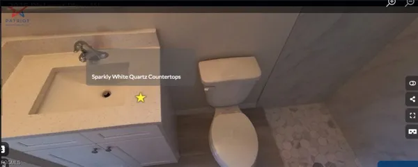 a bathroom with a toilet and a mirror