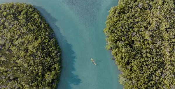 a aerial view of a house with a yard