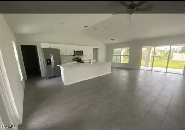 a view of a electric appliances in kitchen and window