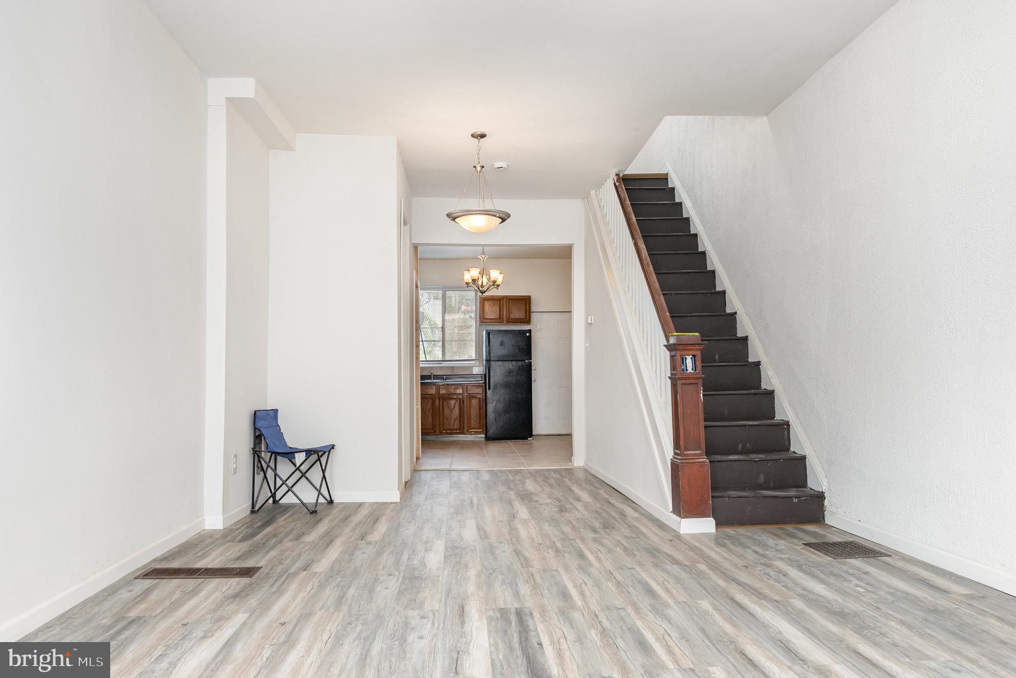 2544 West Fairmount Avenue Baltimore, MD 21223 - Photo 8 of 20 a view of a hallway with wooden floor and entryway