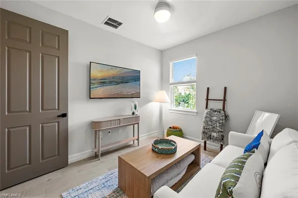 a living room with furniture and a window