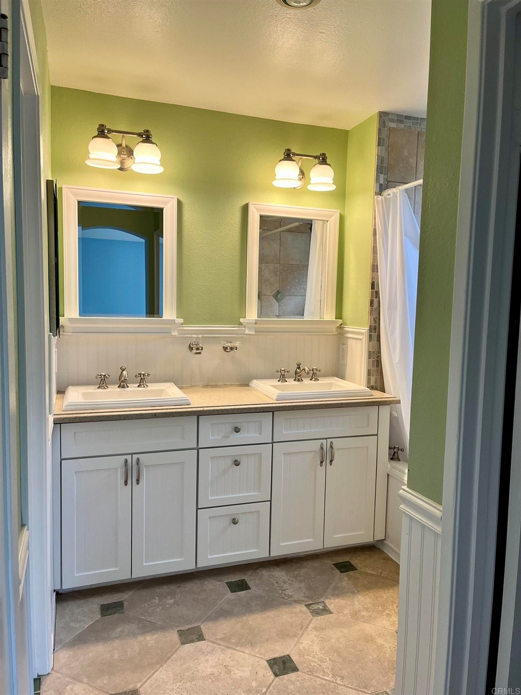 5403 Elderberry Way Oceanside, CA 92057 - Photo 12 of 19 a bathroom with a double vanity sink mirror and