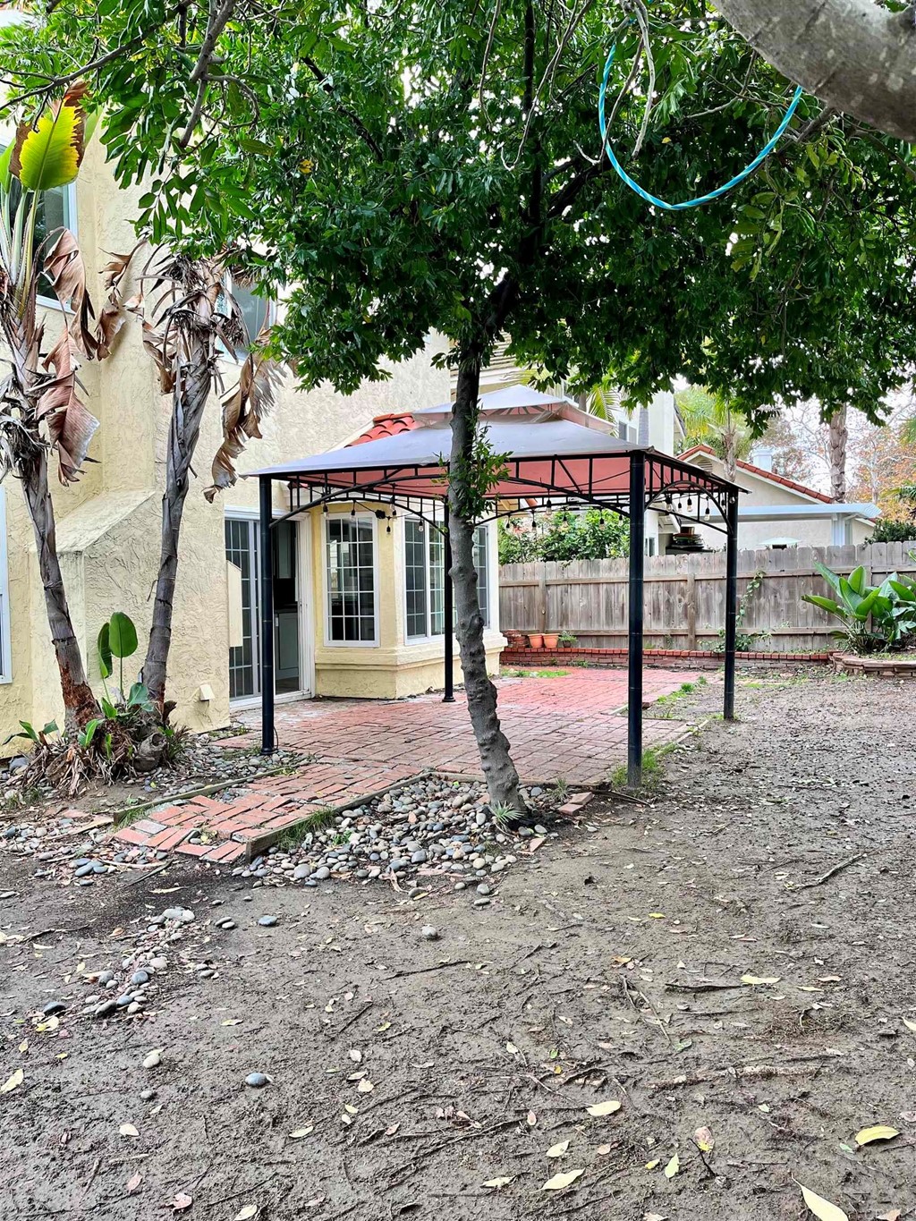 5403 Elderberry Way Oceanside, CA 92057 - Photo 17 of 19 a view of a house with backyard and a tree
