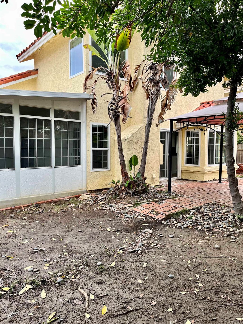 5403 Elderberry Way Oceanside, CA 92057 - Photo 18 of 19 a view of a white house with a large tree
