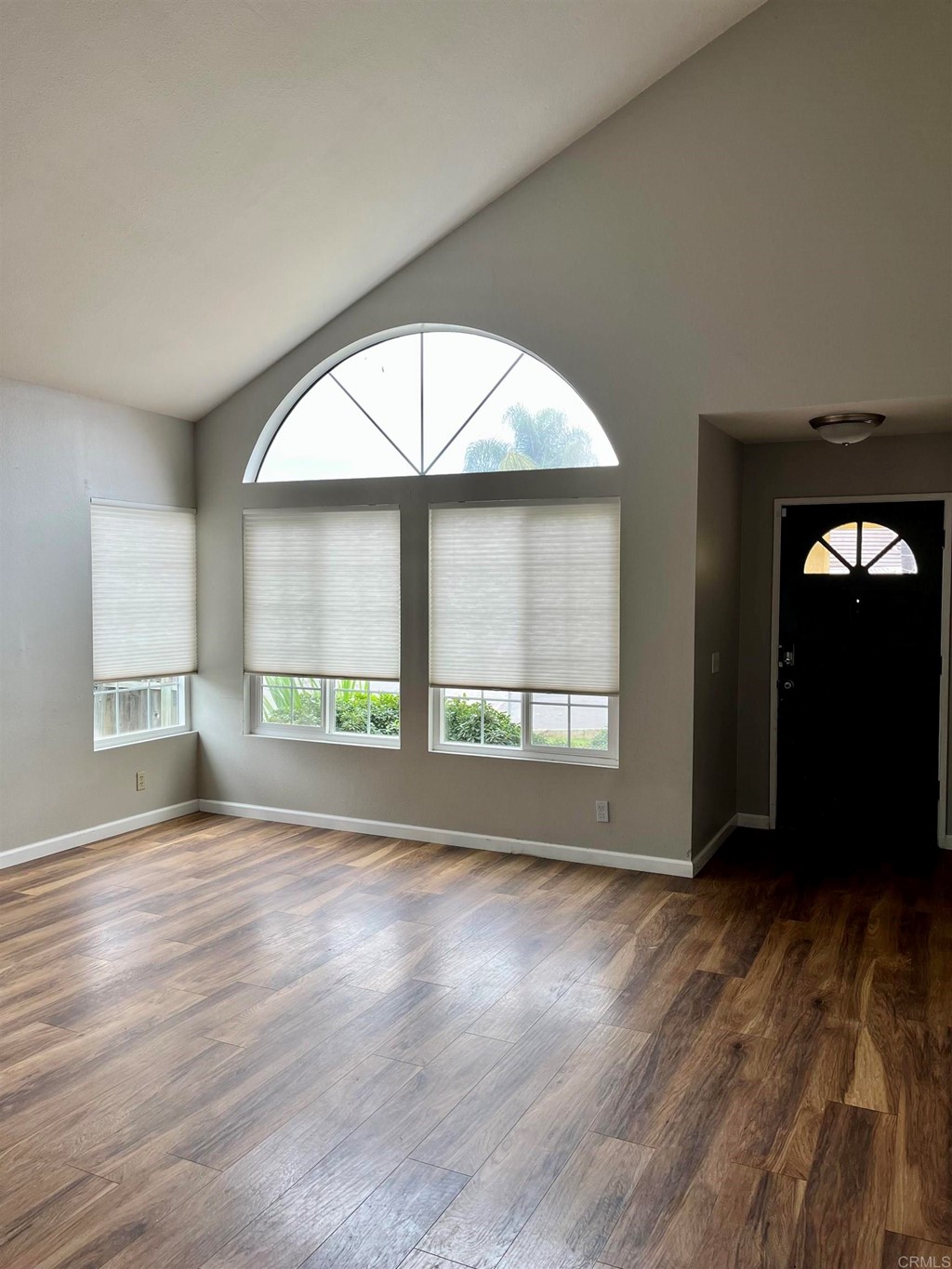 5403 Elderberry Way Oceanside, CA 92057 - Photo 3 of 19 an empty room with wooden floor and windows