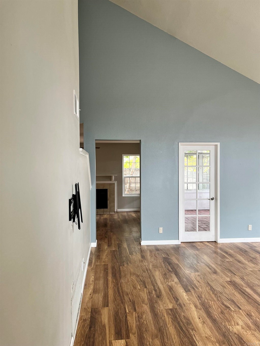 5403 Elderberry Way Oceanside, CA 92057 - Photo 4 of 19 a view of a hallway with wooden floor and a fireplace