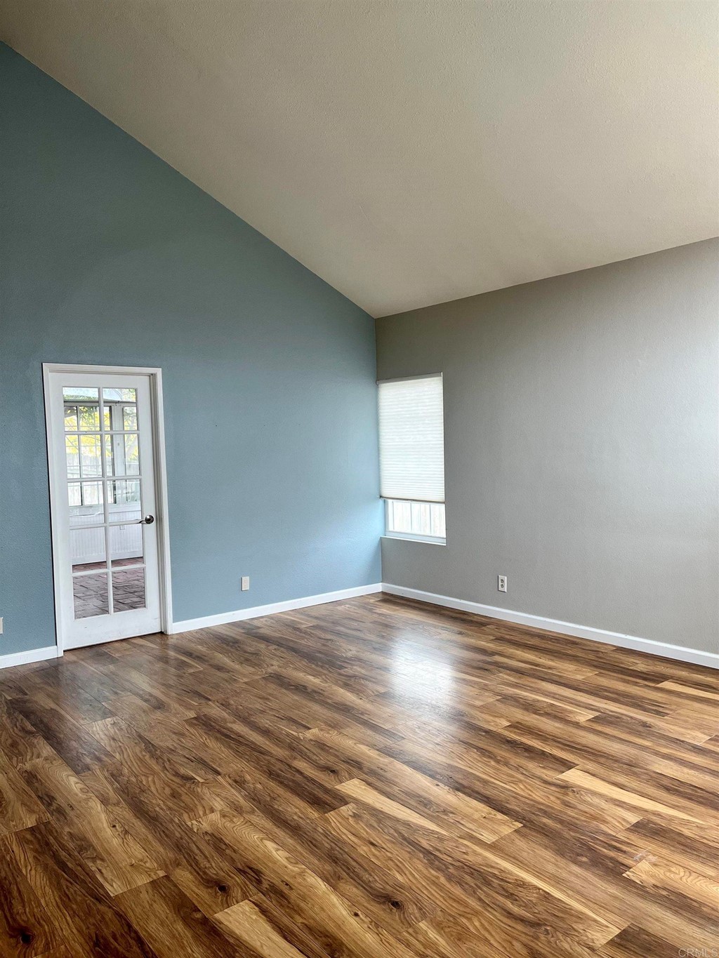 5403 Elderberry Way Oceanside, CA 92057 - Photo 5 of 19 a view of an empty room with wooden floor and window
