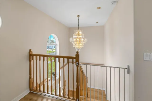 a kitchen with stainless steel appliances granite countertop a sink and a refrigerator