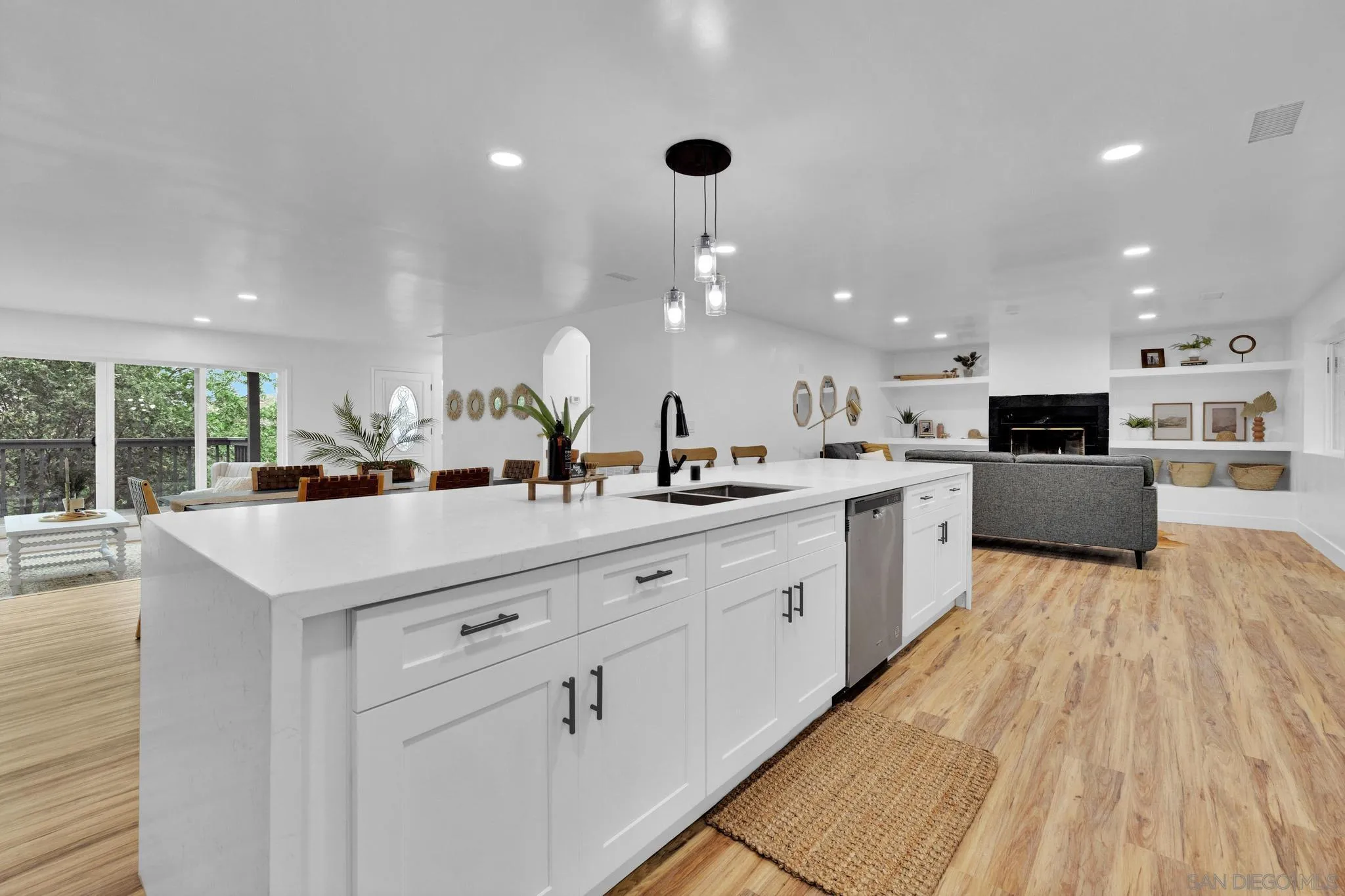 859 Pine Cone Drive Julian, CA 92036 - Photo 11 of 43 a kitchen with stainless steel appliances kitchen island granite countertop a sink and a refrigerator