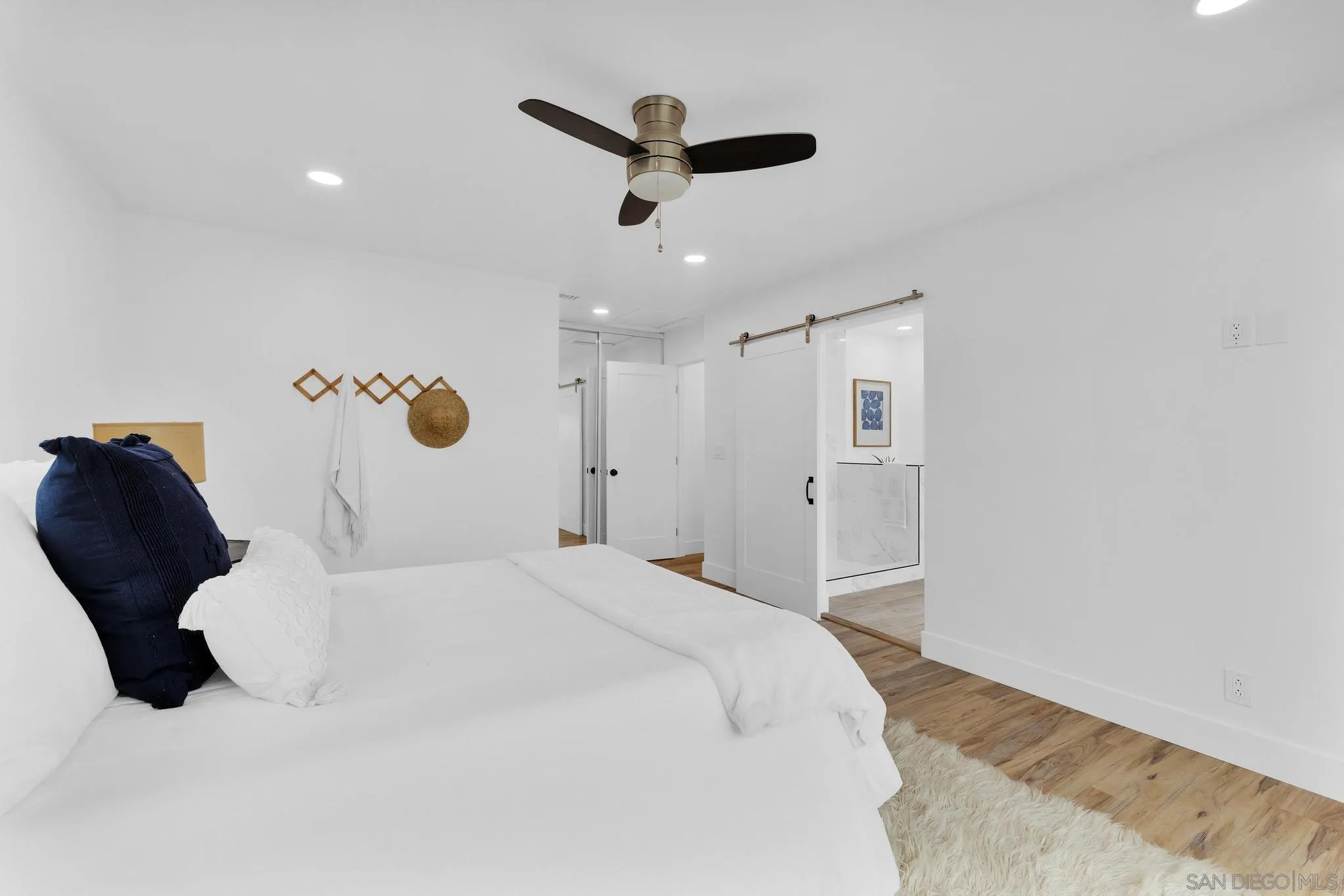 859 Pine Cone Drive Julian, CA 92036 - Photo 19 of 43 a bed room with a bed and a ceiling fan