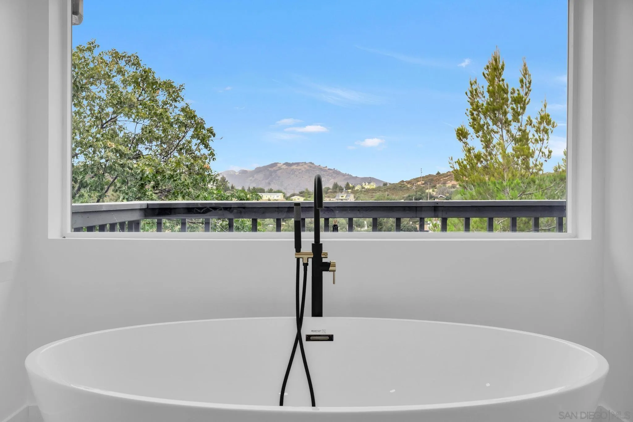 859 Pine Cone Drive Julian, CA 92036 - Photo 21 of 43 a white bath tub sitting in a bathroom