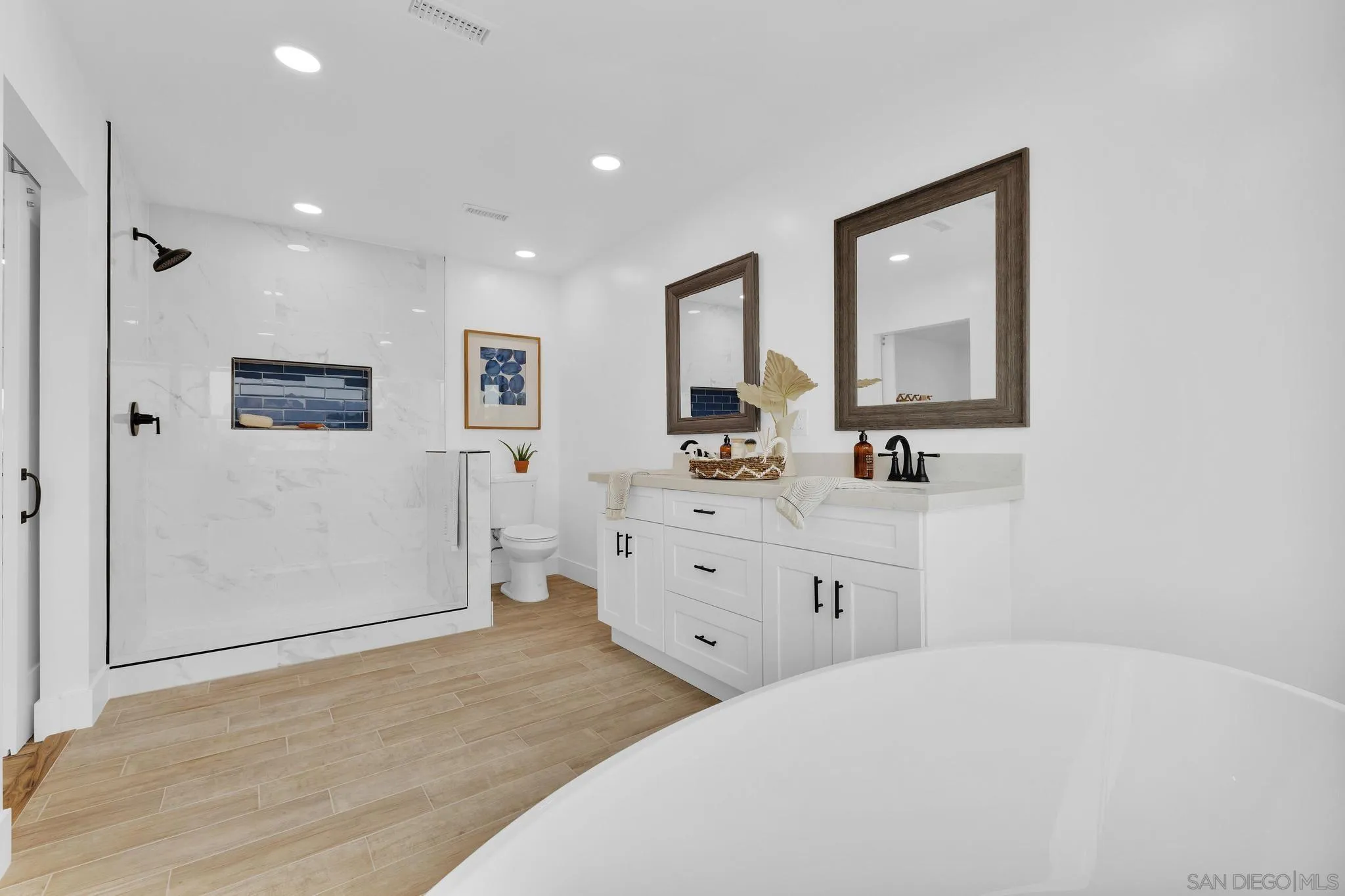 859 Pine Cone Drive Julian, CA 92036 - Photo 22 of 43 a spacious bathroom with a double vanity sink mirror and shower