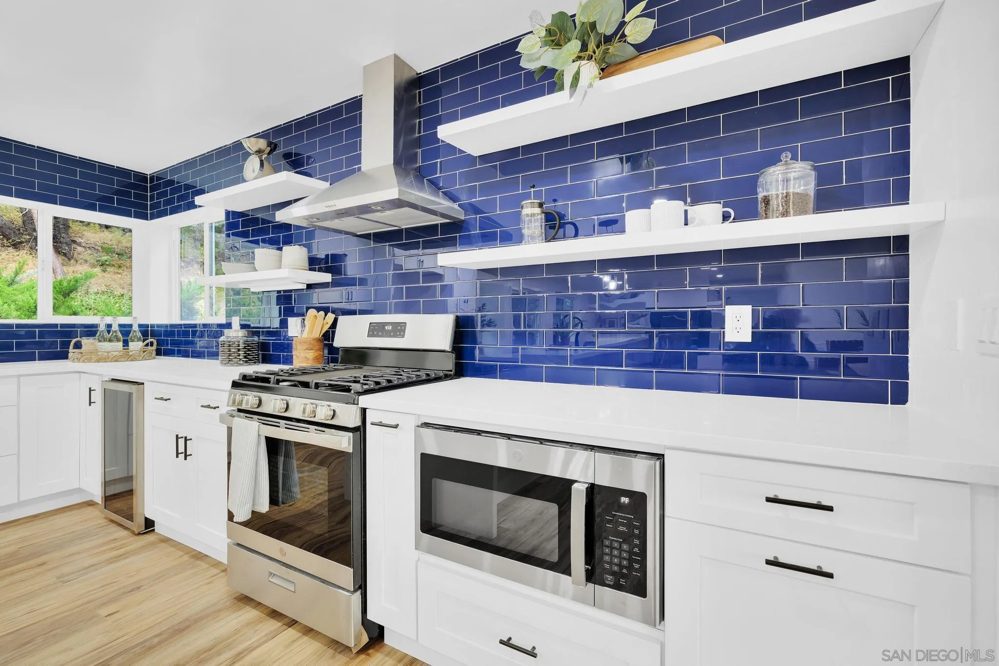 859 Pine Cone Drive Julian, CA 92036 - Photo 9 of 43 a stove top oven sitting inside of a kitchen