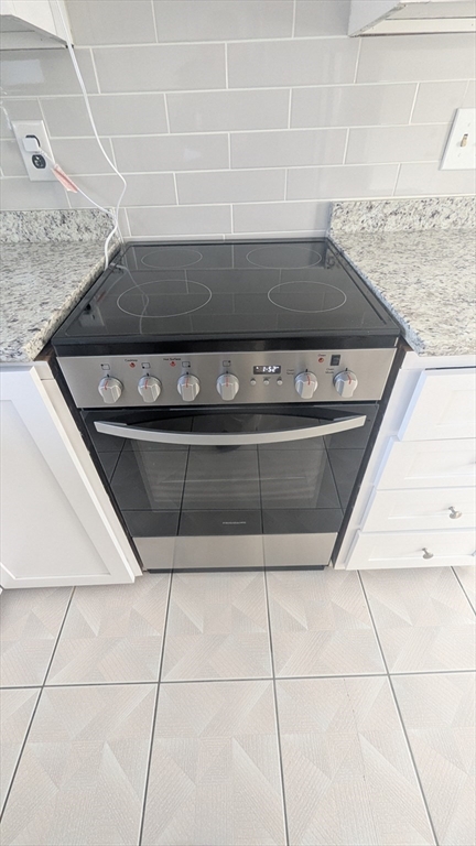 69 Main Street, Unit 2 Foxboro, MA 02035 - Photo 12 of 17 a close view of stove