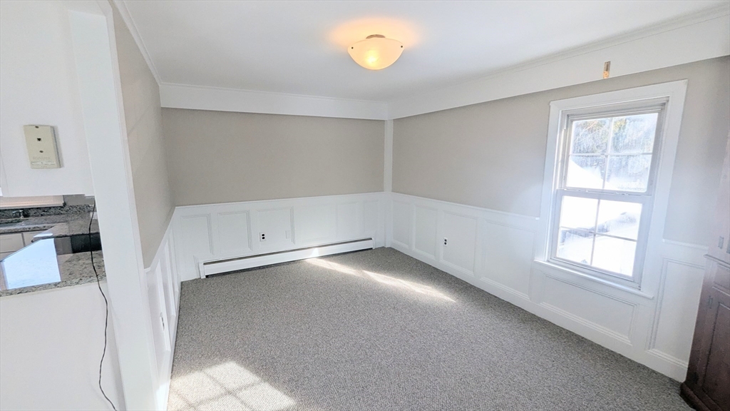69 Main Street, Unit 2 Foxboro, MA 02035 - Photo 13 of 17 a view of an empty room with a window