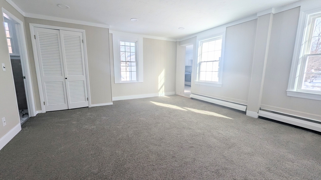 69 Main Street, Unit 2 Foxboro, MA 02035 - Photo 2 of 17 a view of an empty room with a window