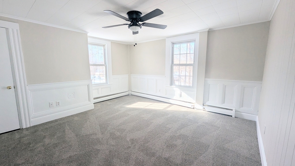 69 Main Street, Unit 2 Foxboro, MA 02035 - Photo 3 of 17 a view of an empty room with a window