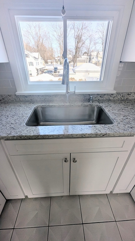 69 Main Street, Unit 2 Foxboro, MA 02035 - Photo 9 of 17 a kitchen with a sink and a window