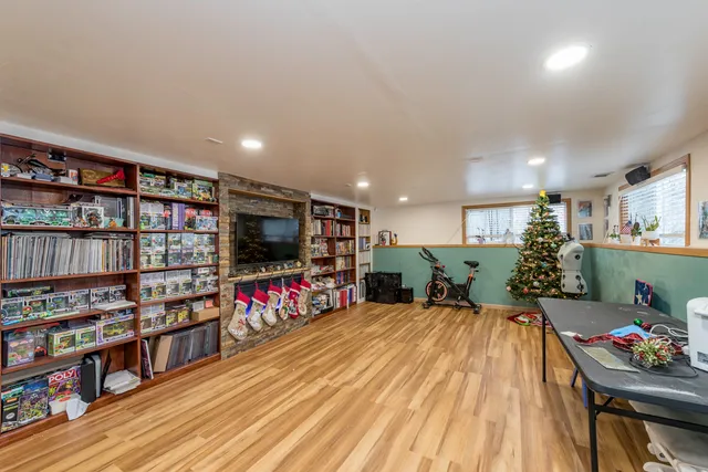 a room with lots of furniture and wooden floor