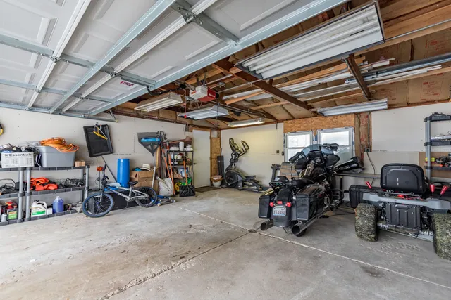 a view of a garage with a bike and wooden roof
