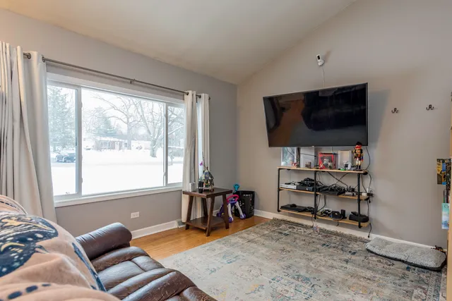 a livingroom with workspace and a window