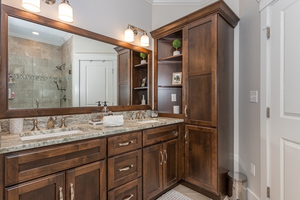 8 Cooks Farm Road, Unit 8 Franklin, MA 02038 - Photo 11 of 30 a bathroom with a granite countertop sink and a mirror