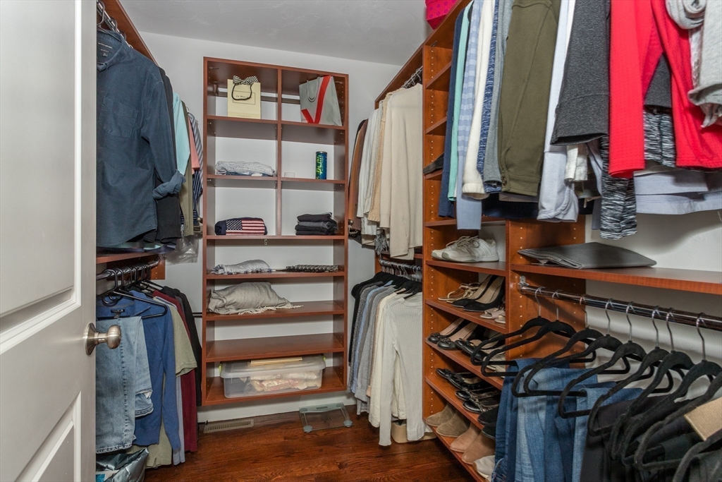 8 Cooks Farm Road, Unit 8 Franklin, MA 02038 - Photo 13 of 30 a view of walk in closet with clothes and shoes