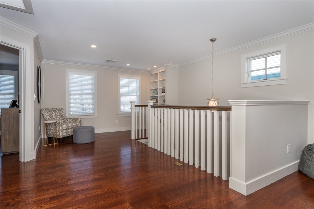 8 Cooks Farm Road, Unit 8 Franklin, MA 02038 - Photo 16 of 30 a view of an empty room and a window with wooden floor