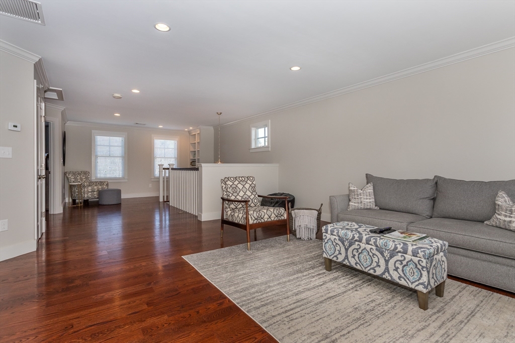 8 Cooks Farm Road, Unit 8 Franklin, MA 02038 - Photo 18 of 30 a living room with furniture and a wooden floor