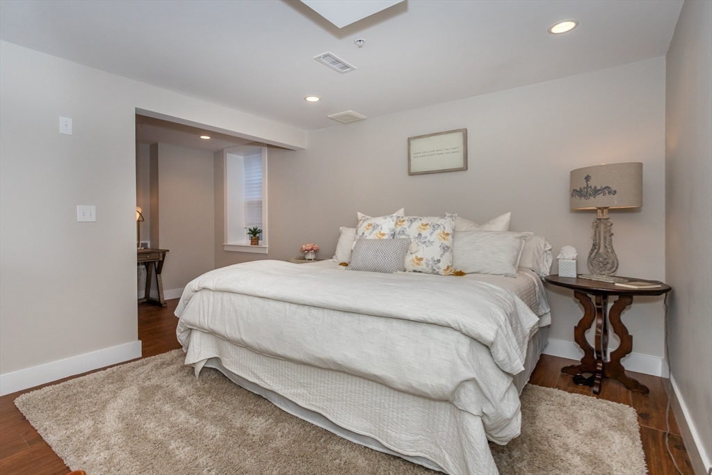 8 Cooks Farm Road, Unit 8 Franklin, MA 02038 - Photo 19 of 30 a bedroom with a bed and a desk