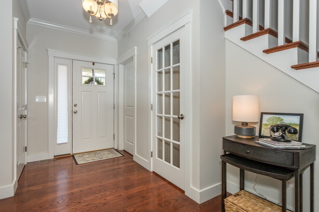 8 Cooks Farm Road, Unit 8 Franklin, MA 02038 - Photo 26 of 30 a view of a hallway to a livingroom with furniture