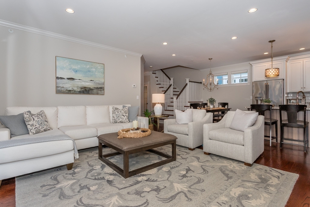 8 Cooks Farm Road, Unit 8 Franklin, MA 02038 - Photo 6 of 30 a living room with furniture and view of kitchen