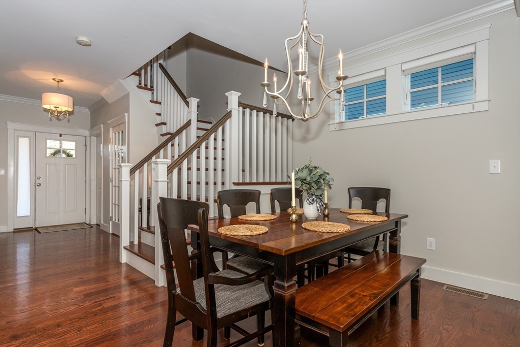 8 Cooks Farm Road, Unit 8 Franklin, MA 02038 - Photo 8 of 30 a view of a dining room with furniture and wooden floor
