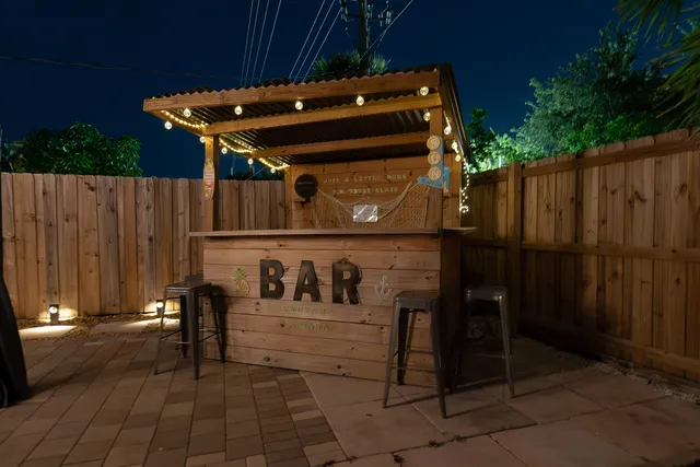 a view of a dinning table and chairs in patio