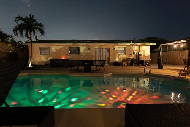 a view of a backyard with palm tree