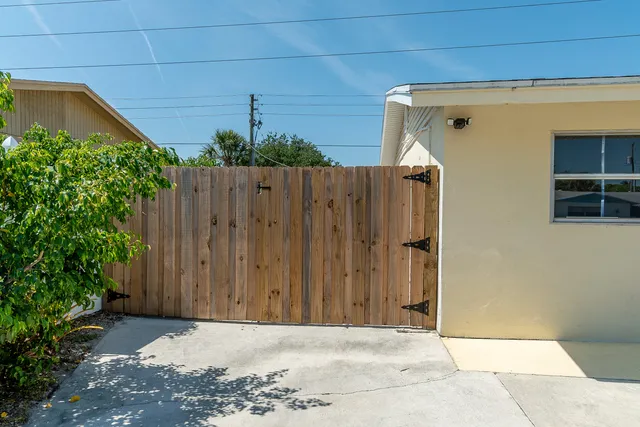an aerial view of a house with outdoor space patio and outdoor seating