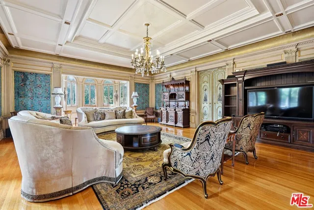 a living room with fireplace furniture and a flat screen tv