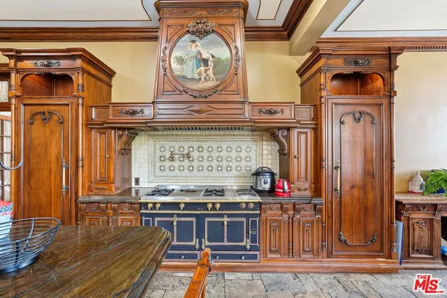 a living room with a stove and a wooden floor