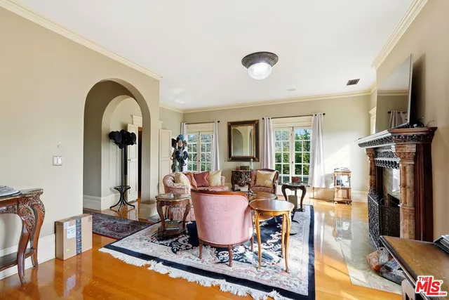 a living room with fireplace furniture and a flat screen tv