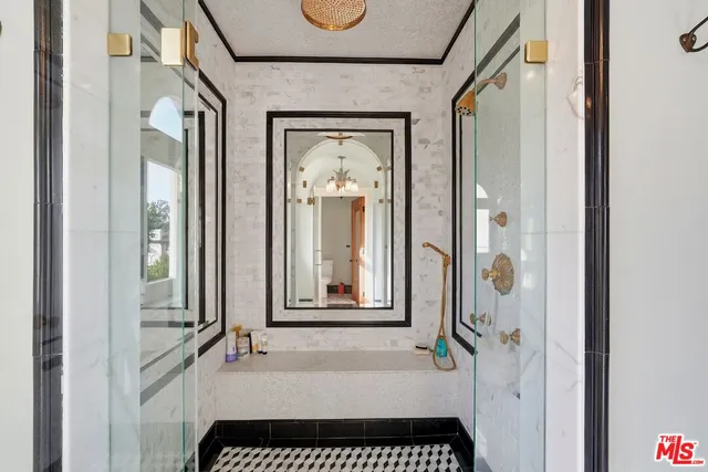 a view of a hallway with a glass door and a window