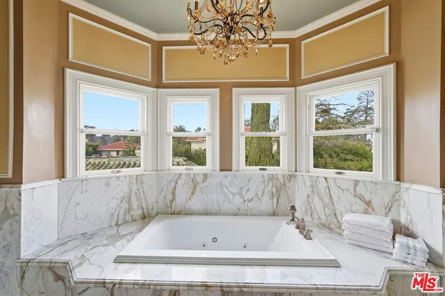 a bathroom with a bathtub and window