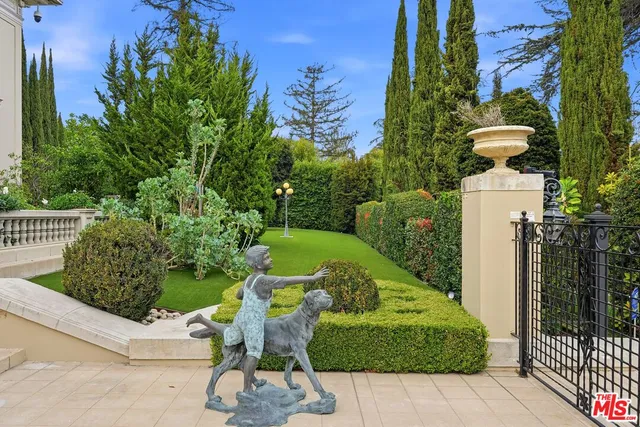 a view of a swimming pool and lounge chairs