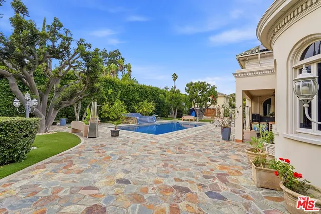 a view of a swimming pool with a patio