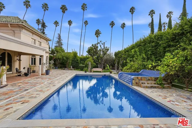 a view of a swimming pool with a sitting area