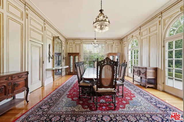 a view of a livingroom with furniture window and wooden floor