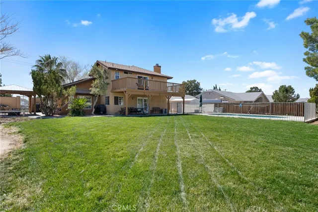 a view of house with a big yard