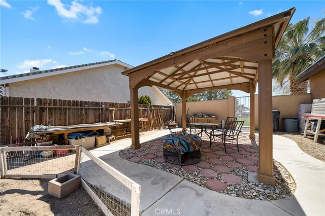 a view of a patio with swimming pool table and chairs