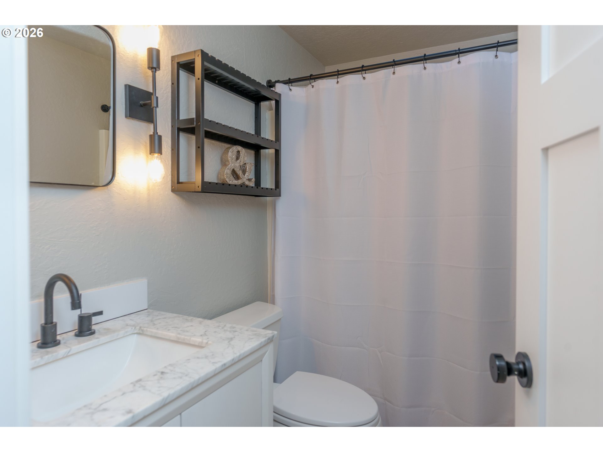8120 Nehalem Road Nehalem, OR 97131 - Photo 15 of 23 a bathroom with a granite countertop sink and a mirror